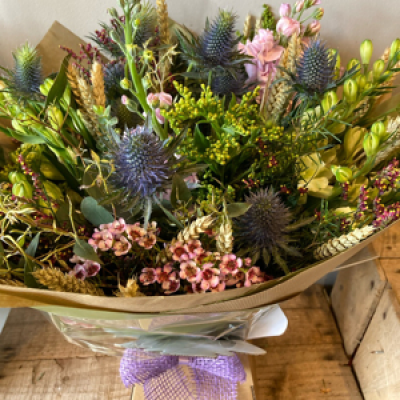 Wonderfully wild - Beautiful selection of flowers to create a wonderful wild looking bouquet. Colours may change but wild looking effect. Hand tied and presented in a bubble of water. Packaging to be as natural and eco friendly as possible