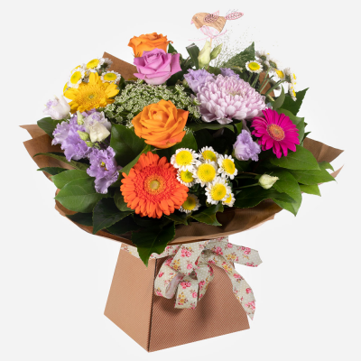 Tutti Fruit - This charming hand-tied floral arrangement looks good enough to eat. A delicious array of blooms with heads held high supported with glorious greenery.
