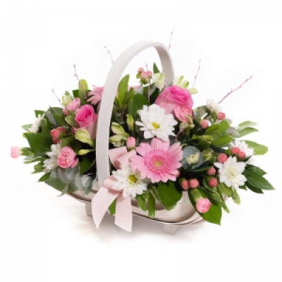 Baby Girl Pink Basket - A floral basket overflowing with pick and white flowers, neatly arranged with foliage.
