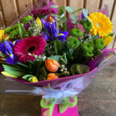 Spring explosion - Selection of spring flowers in a Handtie delivered in a bubble of water in a box.