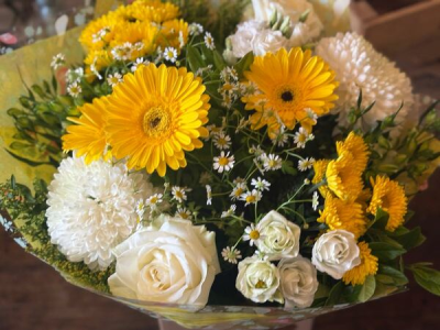 Golden Sunshine - A cheerful hand-tied bouquet in bright yellow and crisp white tones, beautifully arranged to bring warmth and happiness to any occasion.